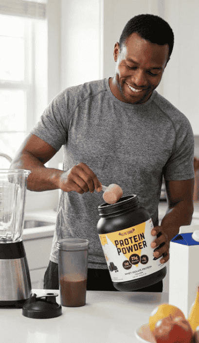 A man preparing a chocolate protein shake using EliteCore Protein Powder with added BCAAs.